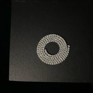 18 mm moissanite real gold won’t fade!! shines gorgeous in the sun and etc…